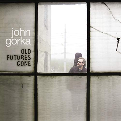 CD cover for John Gorka’s “Old Futures Gone” featuring a man with a guitar.