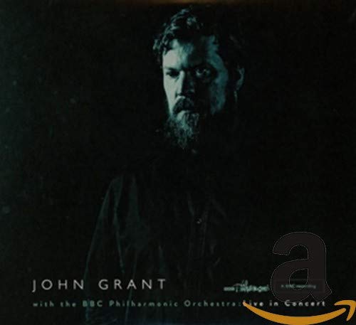 CD cover featuring a portrait of John Grant with dark, moody lighting.