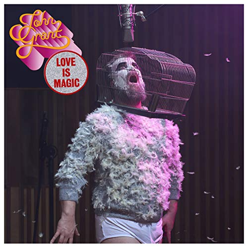 "Album cover with man wearing a birdcage on his head, surrounded by feathers."