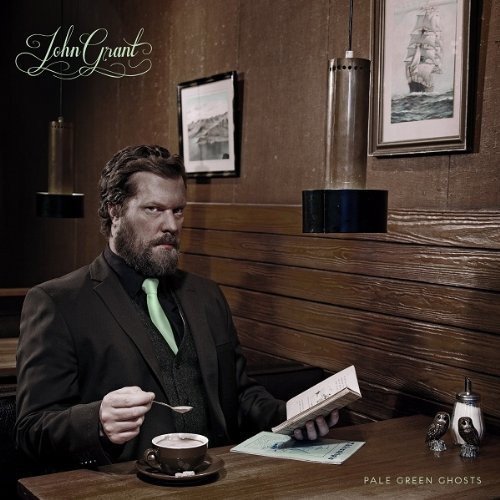 John Grant album cover: man with beard at a diner table.