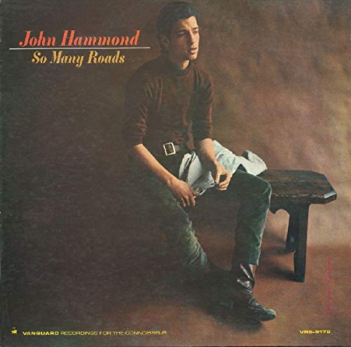 Album cover with a man sitting on a bench, holding a jacket.