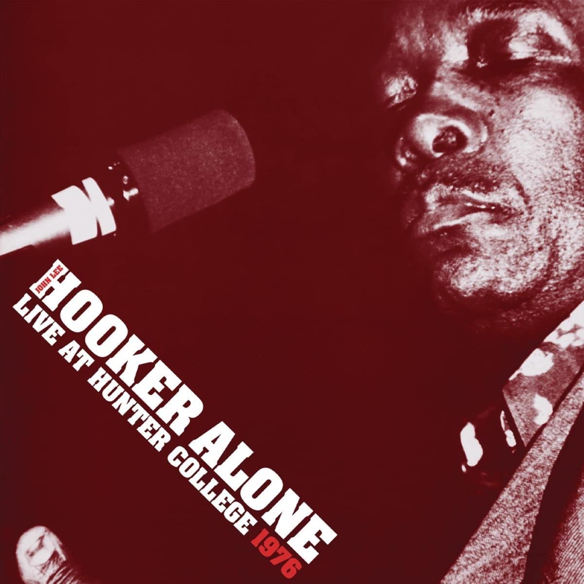 John Lee Hooker's album cover featuring a close-up of the musician at a microphone.
