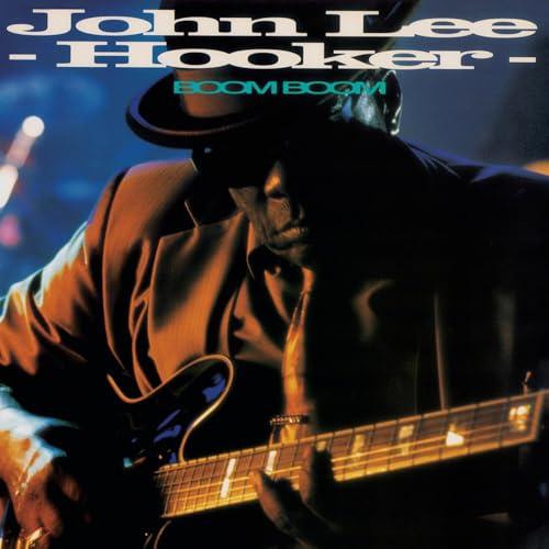 John Lee Hooker playing guitar, album cover for “Boom Boom” CD.