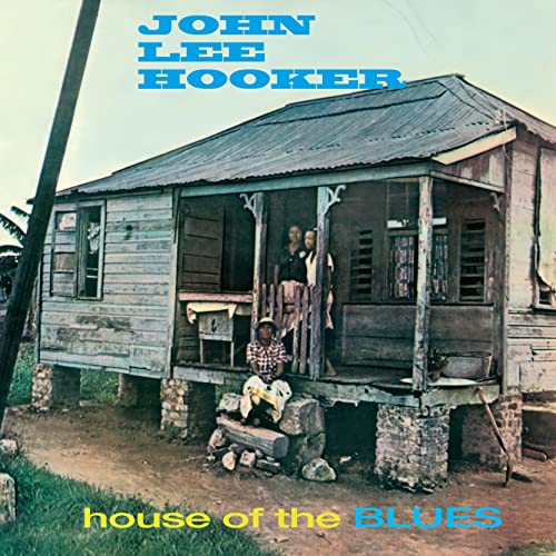 Album cover showing a wooden house on stilts with people on the porch.