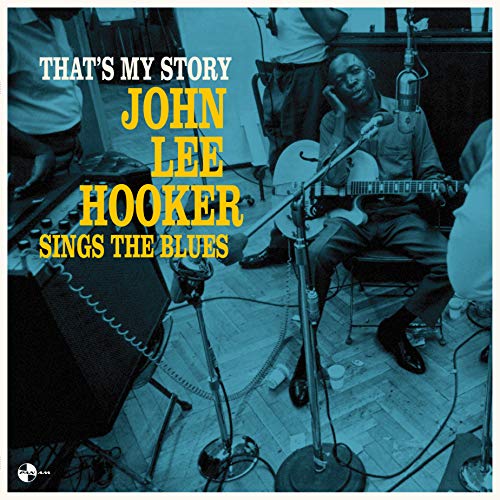 John Lee Hooker playing guitar in a studio with yellow text overlay on blue.