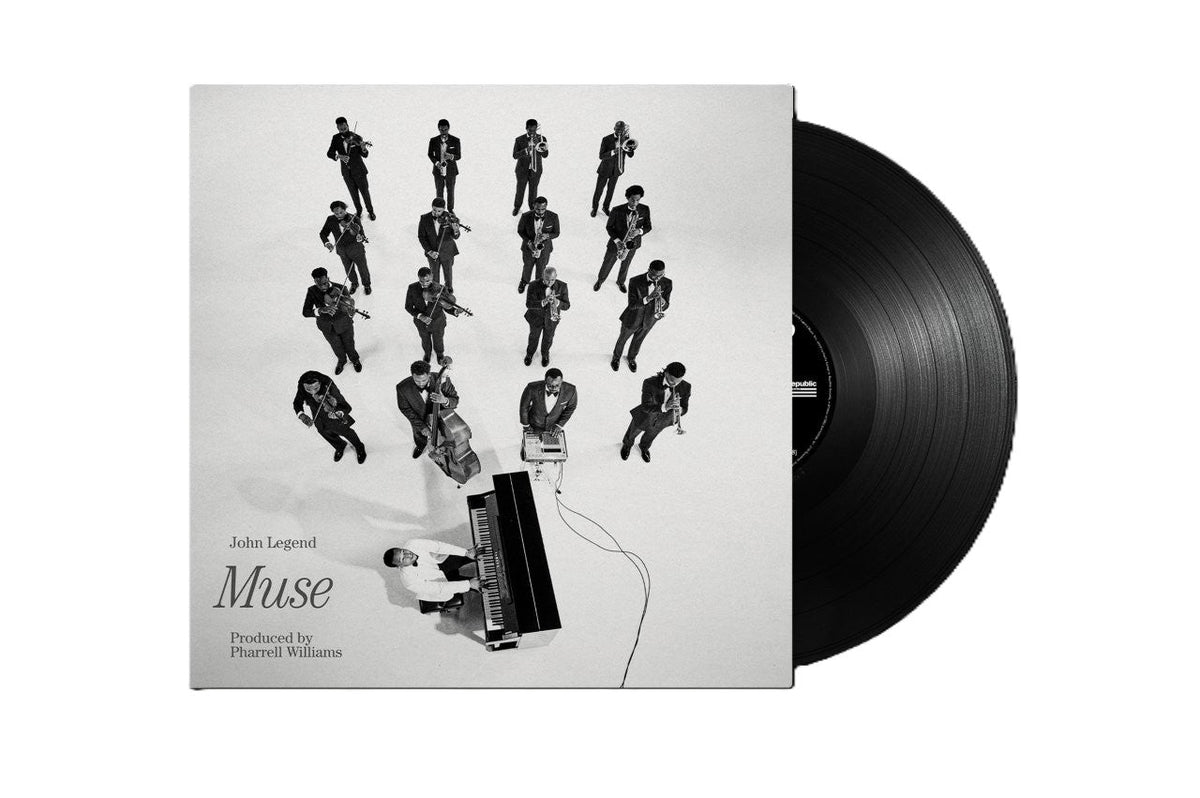 Black and white album cover with musicians around a piano, vinyl record.