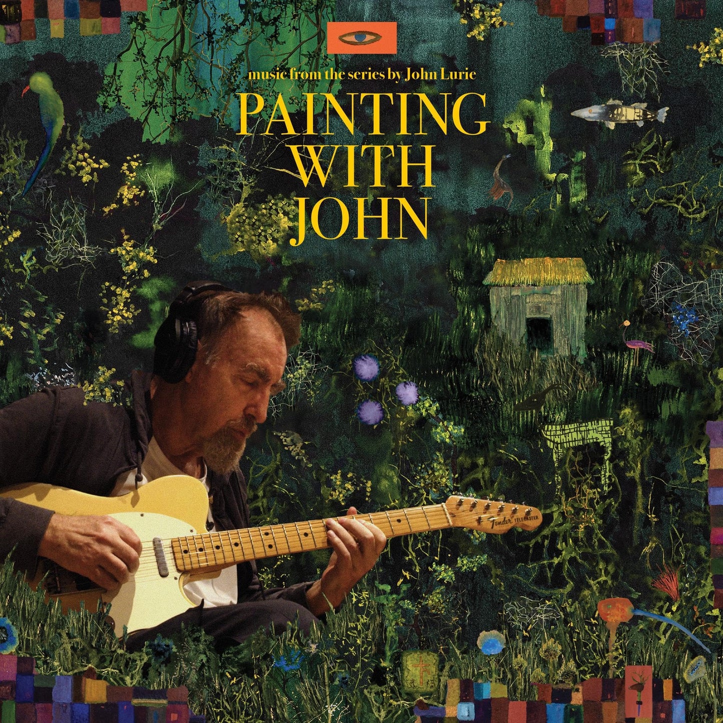John Lurie wearing headphones and playing an electric guitar against a dark, painted background.