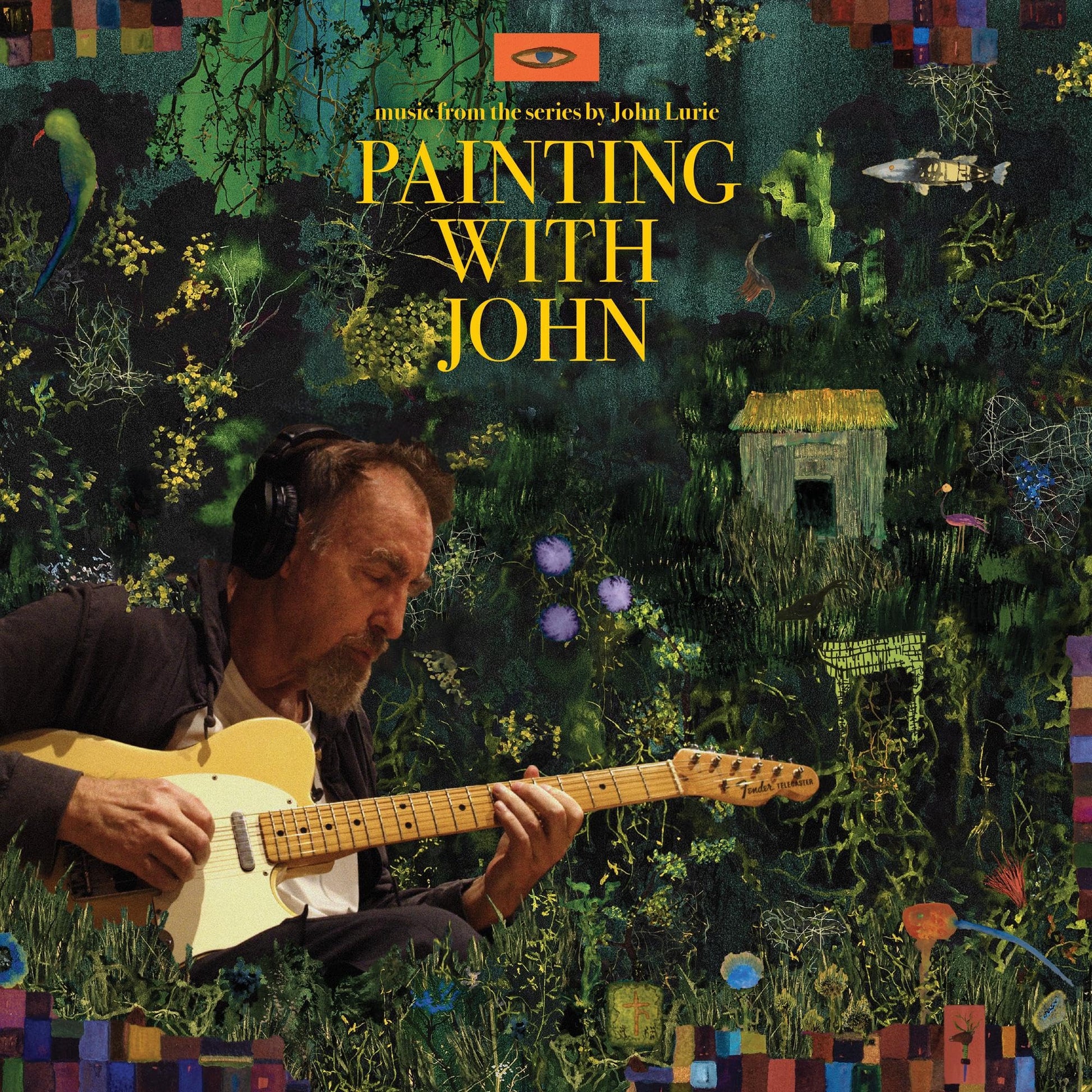 John Lurie wearing headphones and playing an electric guitar against a dark, painted background.