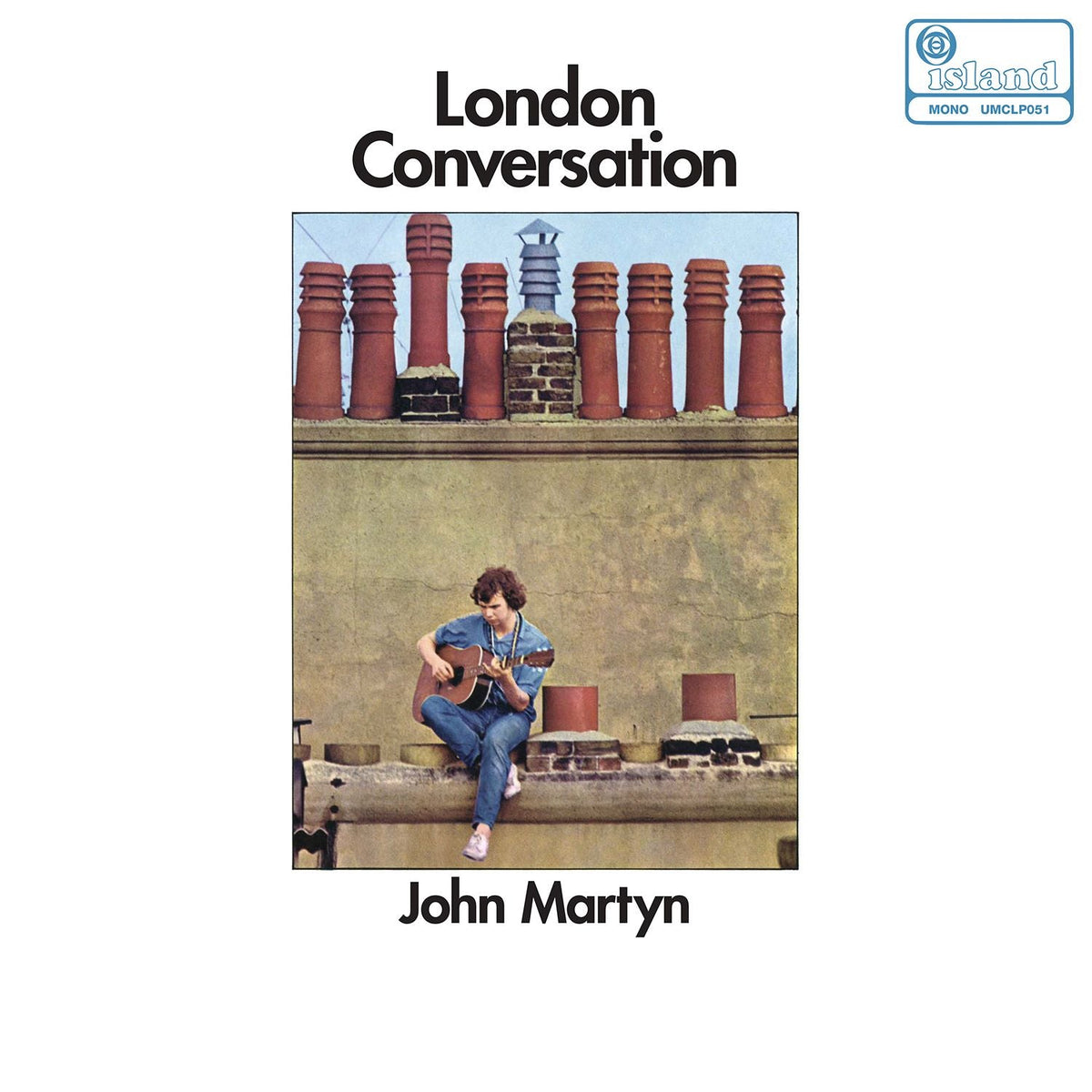 The image depicts a vinyl record cover featuring a man playing guitar. * The man is sitting on a rooftop with chimneys in the background. * The title "London Conversation" is prominently displayed at the top. * The artist's name, "John Martyn", is written below the image. Alt text: Man playing guitar on a rooftop with chimneys.