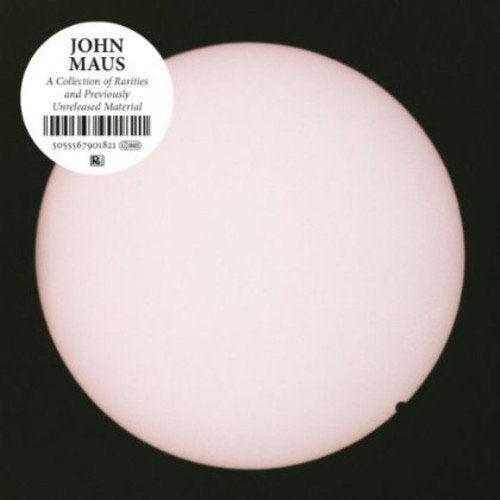 A white circle against a black background with text and a barcode in the corner.