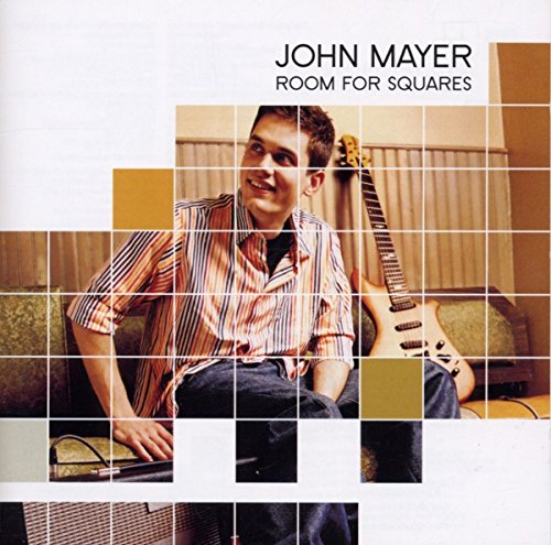 John Mayer sitting with a guitar, depicted through a grid of square image tiles.