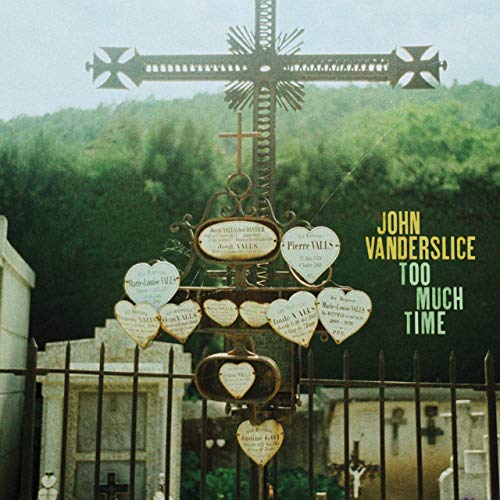Album cover for John Vanderslice's "Too Much Time" featuring a metal cross.