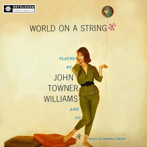Album cover: woman with a string holding a globe, titled "World on a String".