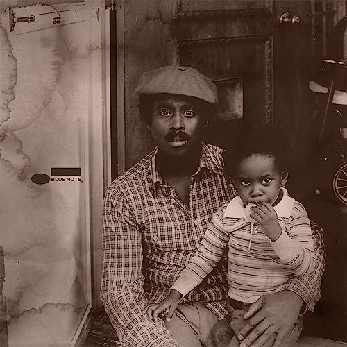 Sepia-toned album cover featuring a man and child in front of a door.