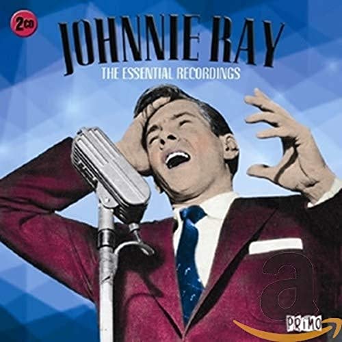 Johnnie Ray singing into a vintage microphone, album cover art.