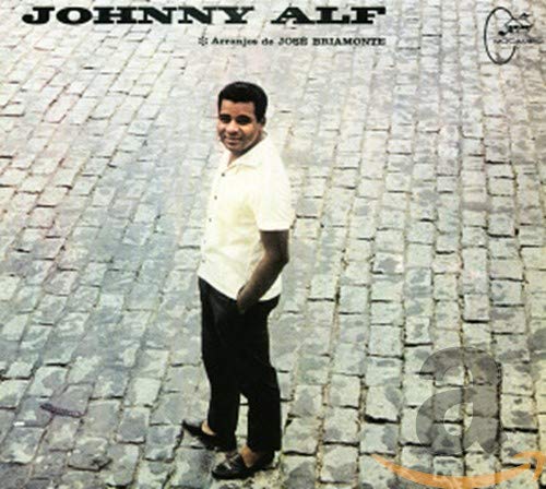 CD cover of Johnny Alf, a man in white standing on cobblestones.