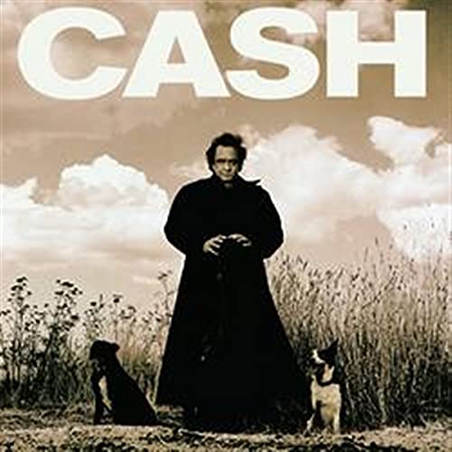 Johnny Cash album cover: portrait of Cash with dogs in a field.