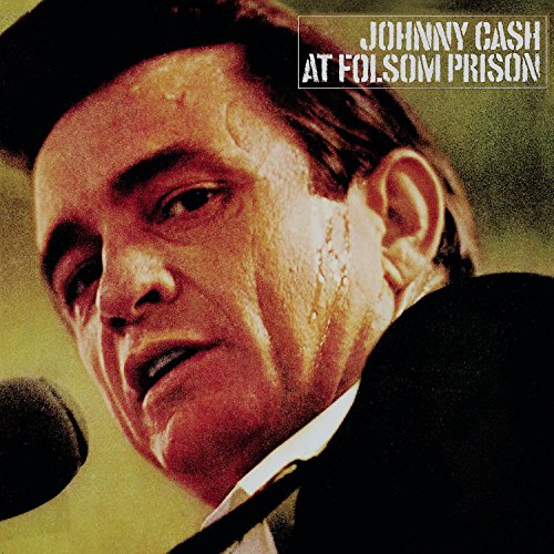 Johnny Cash album cover, close-up portrait of the singer at a microphone.