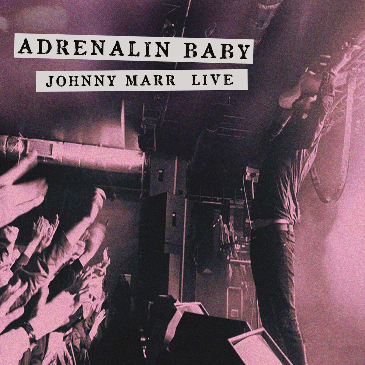 Johnny Marr live album cover with a guitarist and raised hands.