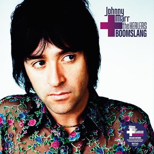 Johnny Marr wearing a floral shirt on the Boomslang album cover.