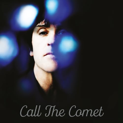 Johnny Marr album cover: close-up of a man’s face with blue light flares.
