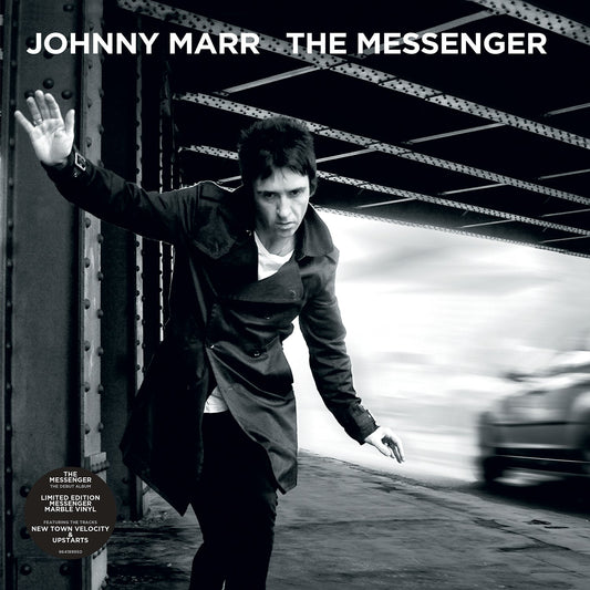 Johnny Marr album cover: man in coat running under a metal bridge.