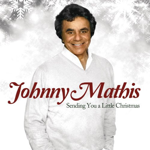 Johnny Mathis album cover, "Sending You A Little Christmas," with snowflakes.