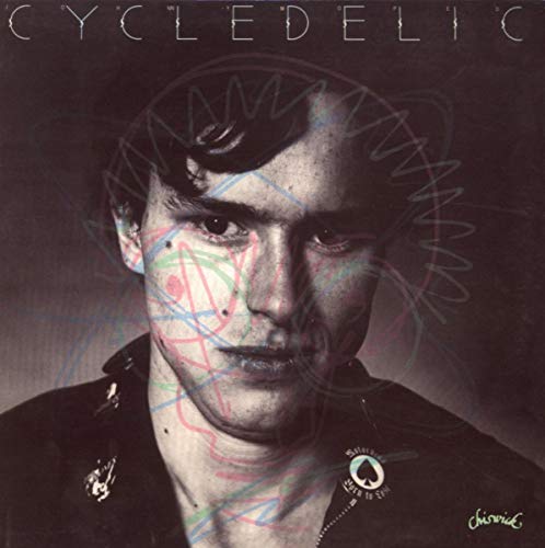 CD cover: portrait of a man with colorful scribbles over his face.