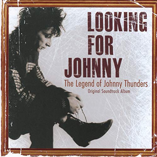 CD cover for “Looking For Johnny” featuring Johnny Thunders tying his shoe.