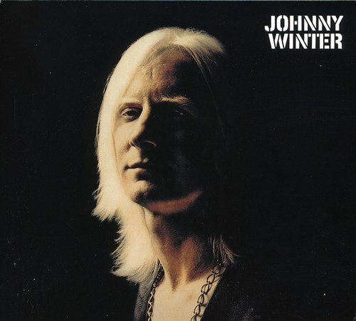 "Album cover with Johnny Winter's portrait, white hair, and chain, against a black background."