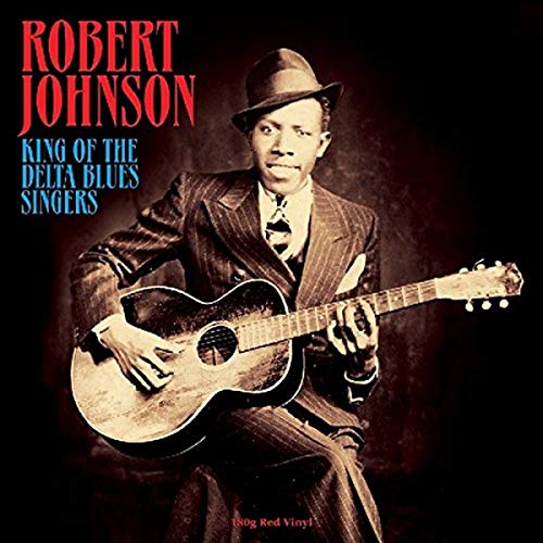Robert Johnson in a suit playing an acoustic guitar, album cover.