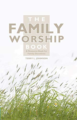 Book cover with title "The Family Worship Book" over a grassy field.