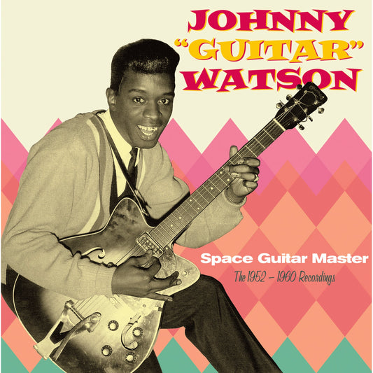 Johnny Guitar Watson holding an electric guitar against a colorful diamond-patterned background.