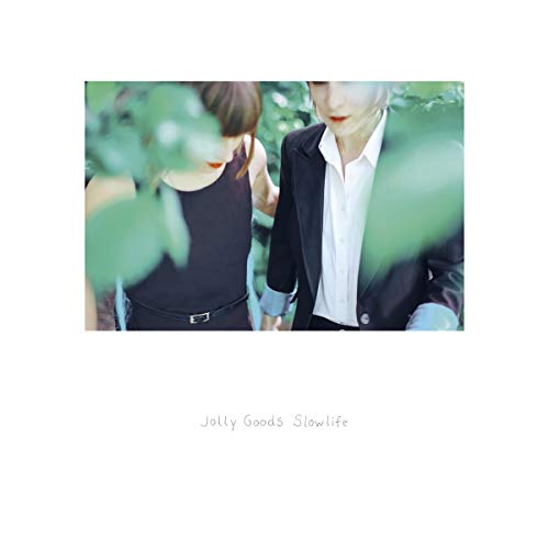 Two people partially obscured by leaves, album cover for "Slowlife".