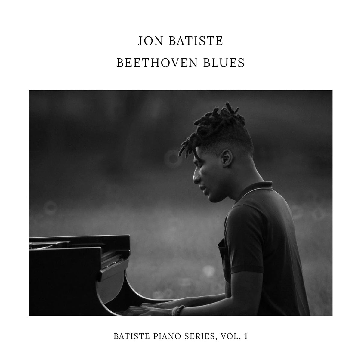 Jon Batiste album cover: grayscale image of a man at a piano.