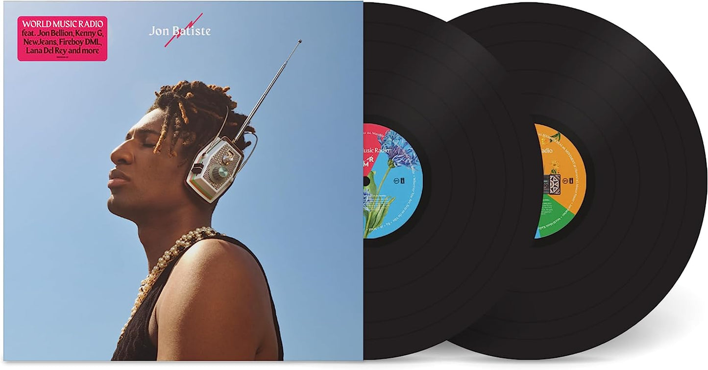"Vinyl record album cover with man wearing headphones and two black vinyl records."