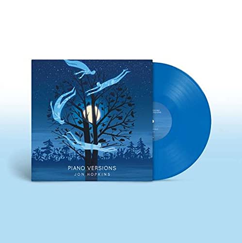 Blue vinyl record of Jon Hopkins’ “Piano Versions” album with tree artwork.