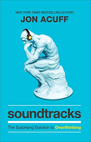 Book cover: a blue background with a statue wearing headphones.
