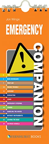 Orange and black spiral-bound "Emergency Companion" guide with warning triangle.