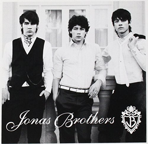 Black and white photo of the Jonas Brothers, album cover.