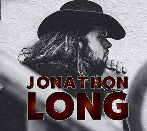 Black and white portrait of Jonathon Long wearing a cowboy hat.