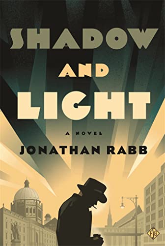 Book cover: "Shadow and Light" with a silhouetted figure and city skyline.