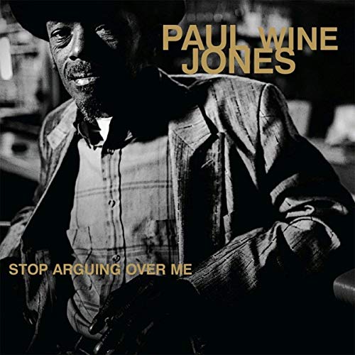 "Album cover featuring a black-and-white photo of Paul Jones, wearing a hat and jacket."
