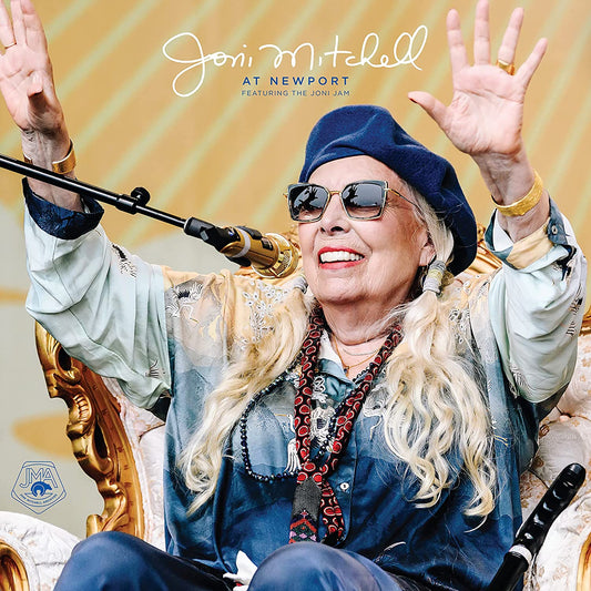Joni Mitchell album cover: portrait of singer with microphone, wearing a beret.