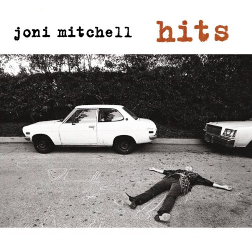 "Joni Mitchell's 'Hits' CD cover featuring a black-and-white image of a woman lying on the ground."