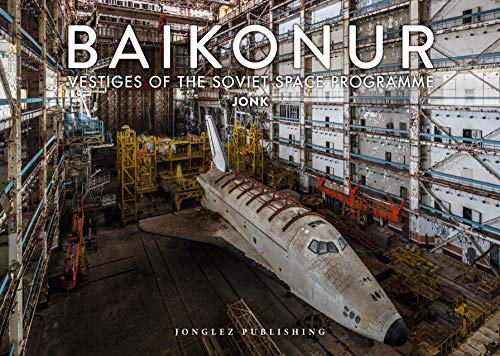 An abandoned Soviet space shuttle inside a large, industrial hangar at Baikonur.