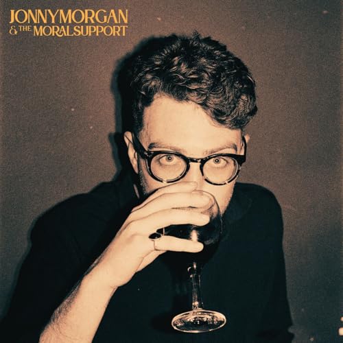 CD cover featuring a man with glasses holding a glass of wine.