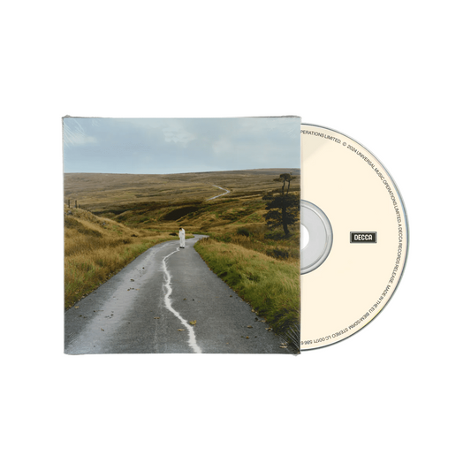 CD case with a grayscale image of a road and distant figure.