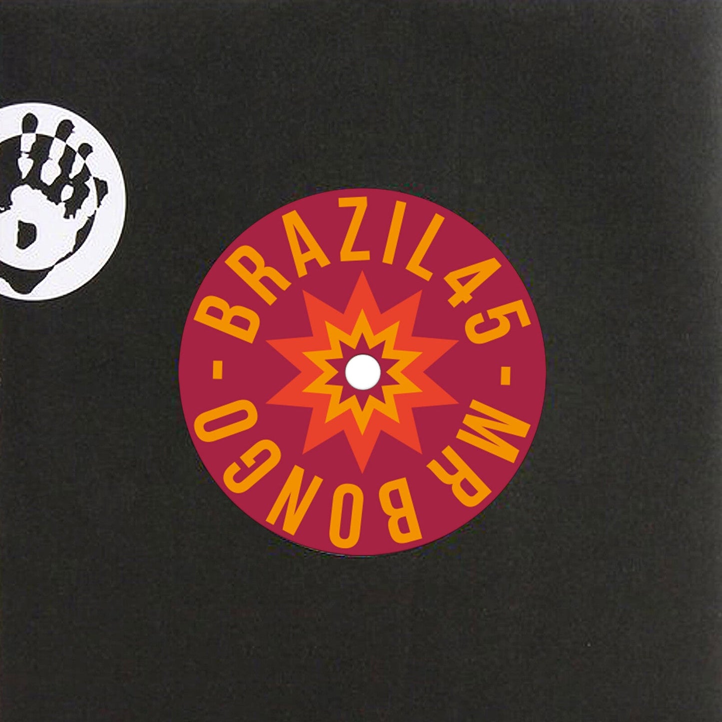 Vinyl record label with orange and red starburst design, black background.