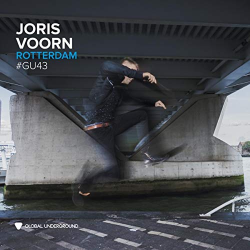 A man jumps in front of a concrete bridge pier with text overlay.